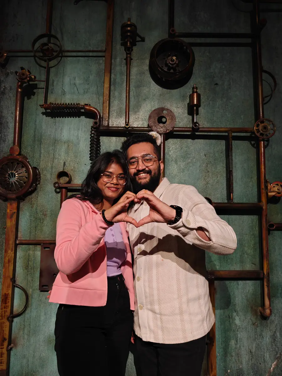 Mamtha and Prem making a heart with their hands